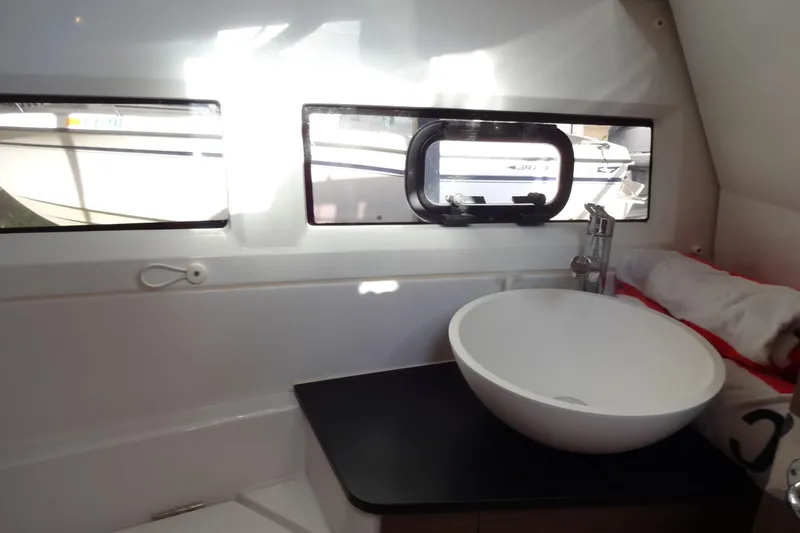 Blue Baby Yacht Photos Pics Interior of 2022 Jeanneau Merry Fisher 895 Offshore, featuring a modern bathroom sink.