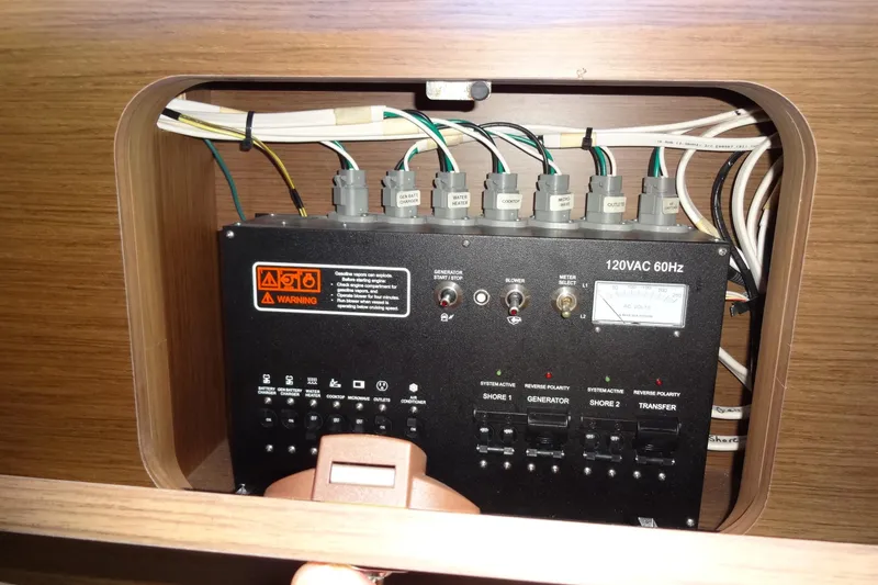 Blue Baby Yacht Photos Pics Electrical panel of 2022 Jeanneau Merry Fisher 895 Offshore boat, showcasing wiring and controls.