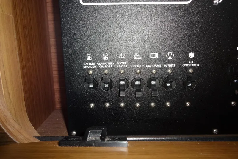 Blue Baby Yacht Photos Pics Control panel of a 2022 Jeanneau Merry Fisher 895 Offshore boat, showing various switches.