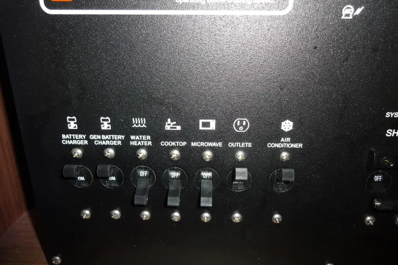 Blue Baby Yacht Photos Pics Control panel of 2022 Jeanneau Merry Fisher 895 Offshore with switches for various systems.