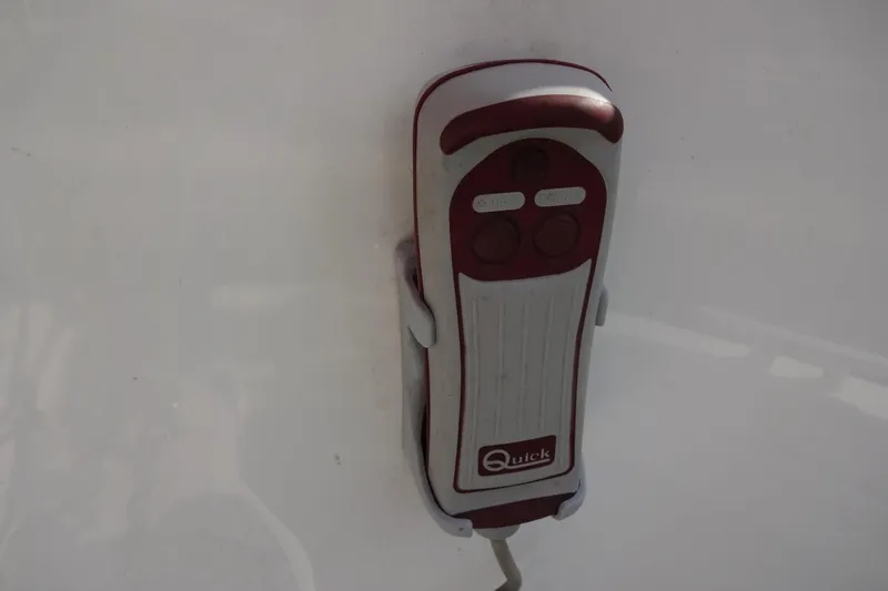 Blue Baby Yacht Photos Pics Remote control for Jeanneau Merry Fisher 895 Offshore 2022 boat, mounted on white surface.