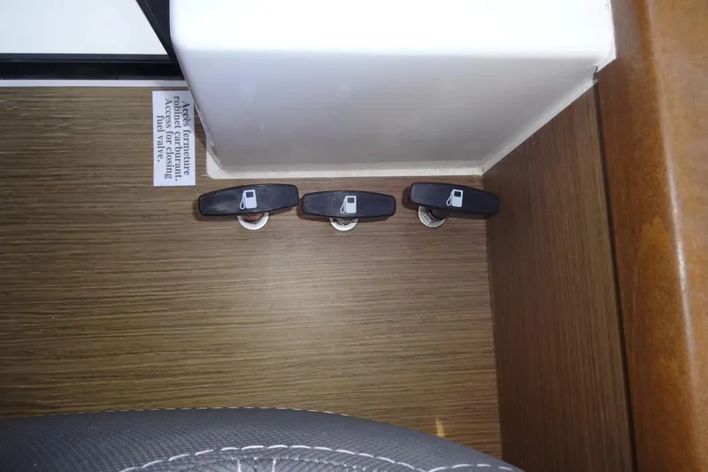 Blue Baby Yacht Photos Pics Fuel valve controls on 2022 Jeanneau Merry Fisher 895 Offshore boat interior.