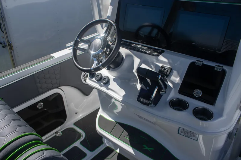 Adeline Yacht Photos Pics 2023 Glasstream 328 GS Xtreme boat cockpit with steering wheel and control panel.