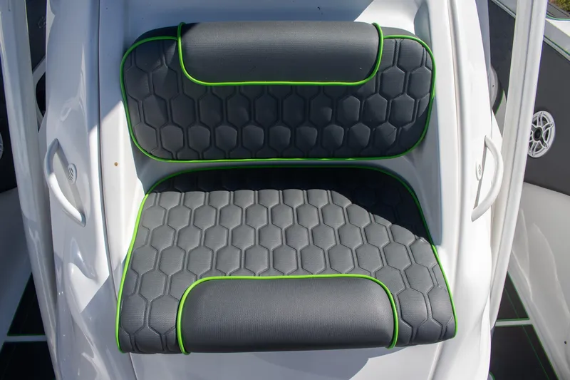 Adeline Yacht Photos Pics 2023 Glasstream 328 GS Xtreme boat seat with hexagonal pattern and green trim.