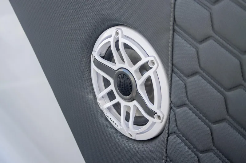 Adeline Yacht Photos Pics 2023 Glasstream 328 GS Xtreme speaker detail with hexagonal upholstery pattern.