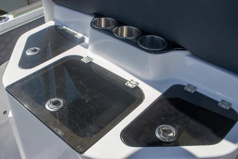 Adeline Yacht Photos Pics 2023 Glasstream 328 GS Xtreme boat interior with storage compartments and cup holders.