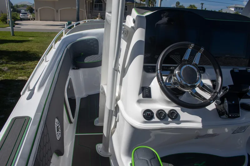 Adeline Yacht Photos Pics 2023 Glasstream 328 GS Xtreme boat interior with modern steering console and sleek design.