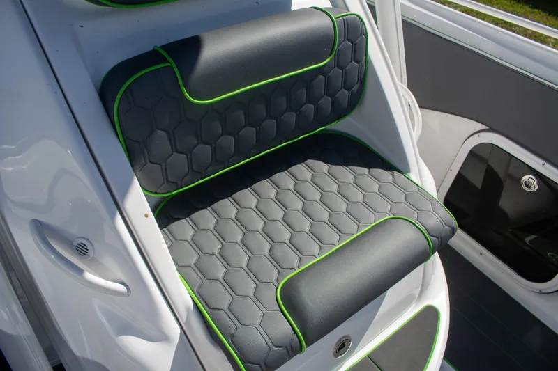 Adeline Yacht Photos Pics 2023 Glasstream 328 GS Xtreme boat seat with hexagonal pattern and green trim.