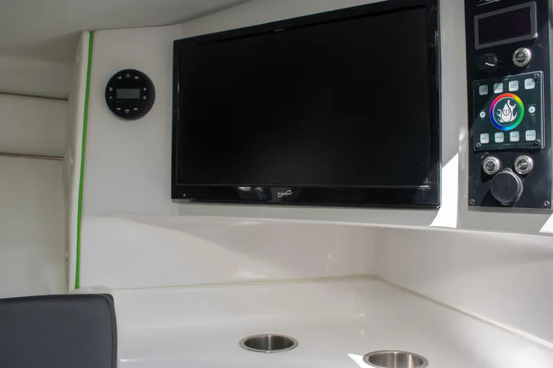 Adeline Yacht Photos Pics Interior of 2023 Glasstream 328 GS Xtreme boat with TV and control panel.
