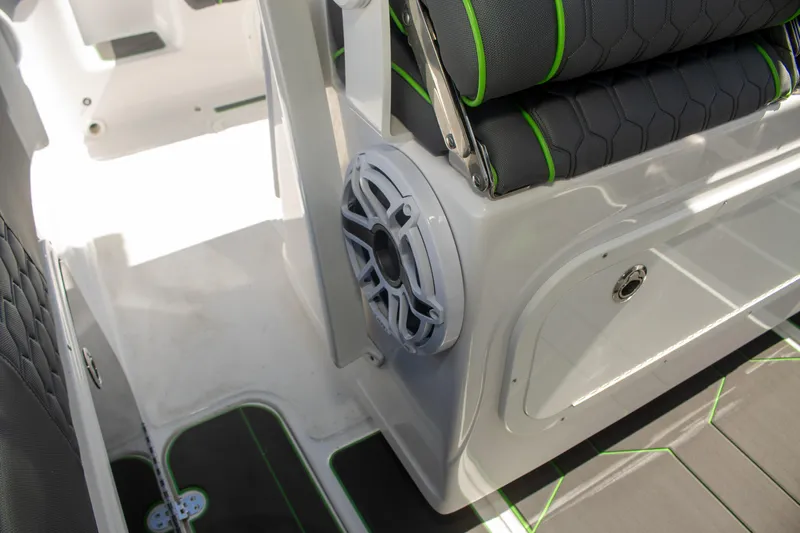 Adeline Yacht Photos Pics 2023 Glasstream 328 GS Xtreme boat interior with speaker and cushioned seating.