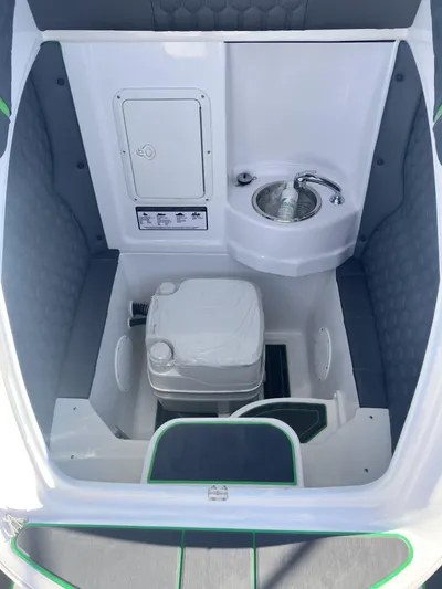 Adeline Yacht Photos Pics 2023 Glasstream 328 GS Xtreme boat interior with compact sink and toilet.