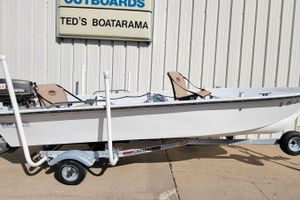 1996 DILKES STUMP JUMPER boat on trailer at Ted's Boatarama, featuring Tohatsu outboard motor.
