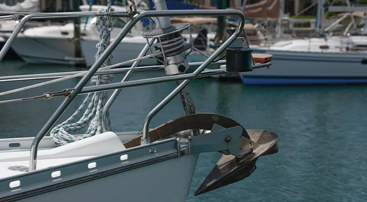 Pelican Yacht Photos Pics Bow of 2002 Jeanneau Sun Odyssey 43 DS yacht with anchor in marina.