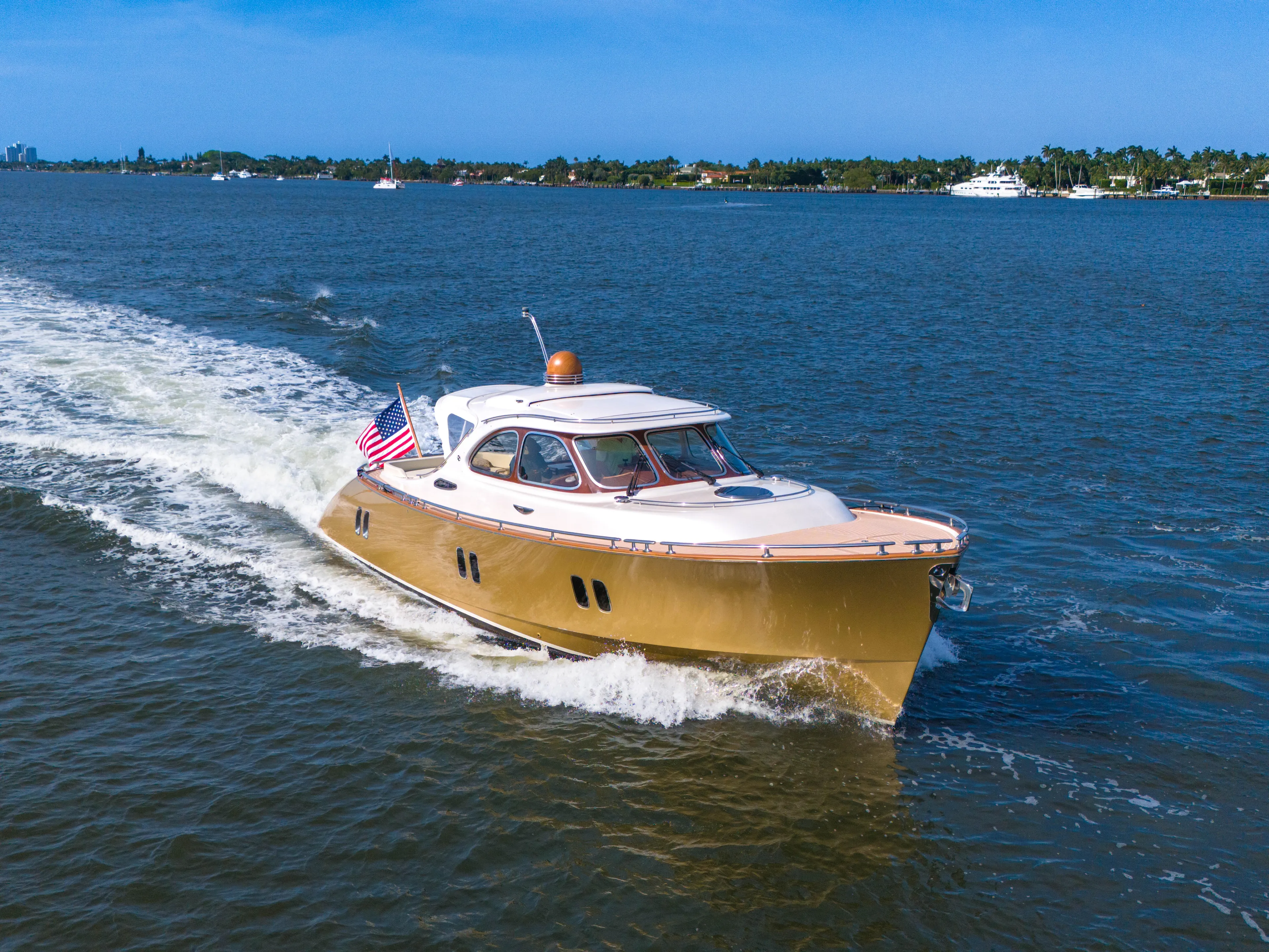 Mississippi Queen Yacht Photos Pics 2012 Zeelander 44 yacht cruising on a sunny day with an American flag.