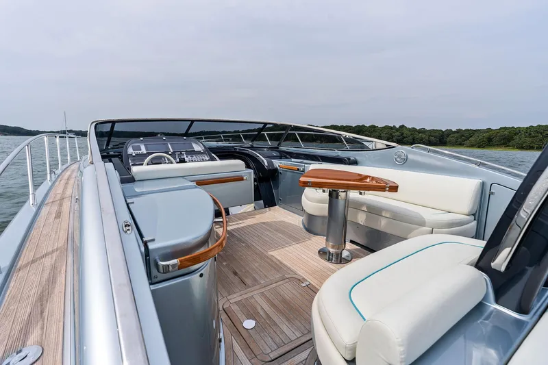 Badleship Yacht Photos Pics Luxurious 2015 Riva Rivale yacht interior with elegant seating and sleek design on open water.