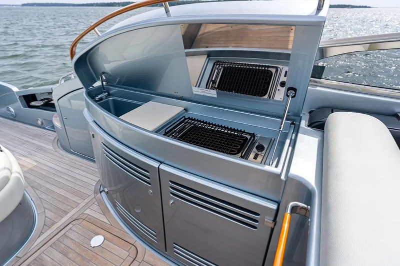 Badleship Yacht Photos Pics Luxury 2015 Riva Rivale yacht with sleek outdoor kitchen and grill on deck.