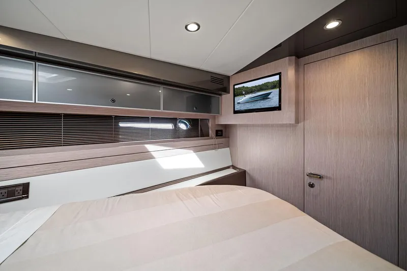 Badleship Yacht Photos Pics Luxurious interior of 2015 Riva Rivale yacht cabin with modern design and wall-mounted TV.