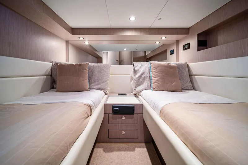 Badleship Yacht Photos Pics Luxurious 2015 Riva Rivale yacht cabin with twin beds and elegant decor.