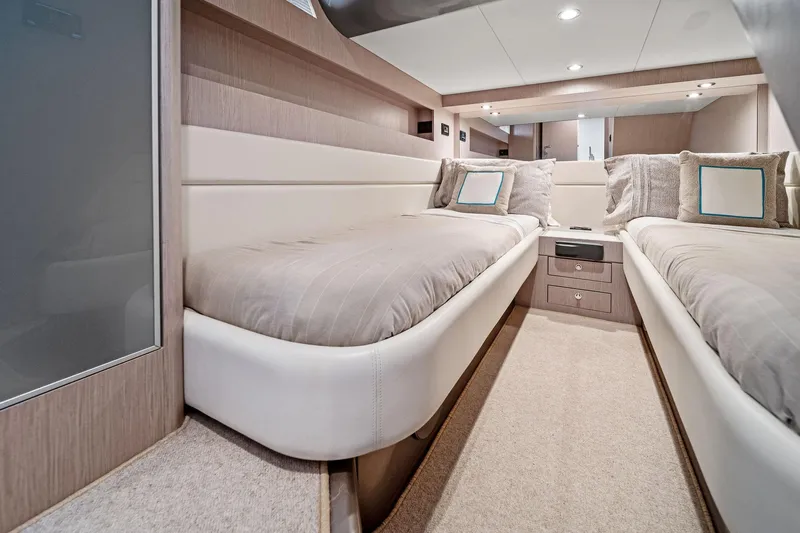 Badleship Yacht Photos Pics Luxurious 2015 Riva Rivale yacht cabin with twin beds and elegant decor.