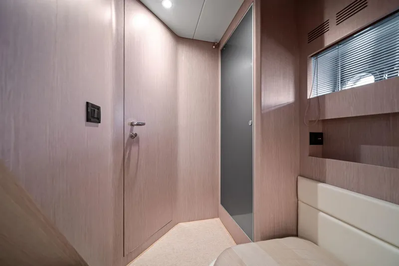 Badleship Yacht Photos Pics Luxurious interior of 2015 Riva Rivale yacht with modern wood paneling and sleek design.