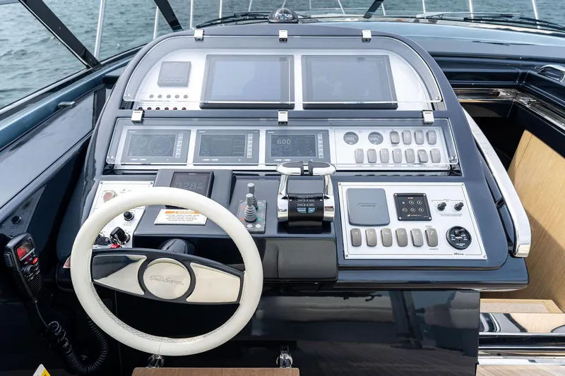 Badleship Yacht Photos Pics Cockpit of 2015 Riva Rivale yacht with advanced navigation controls and steering wheel.