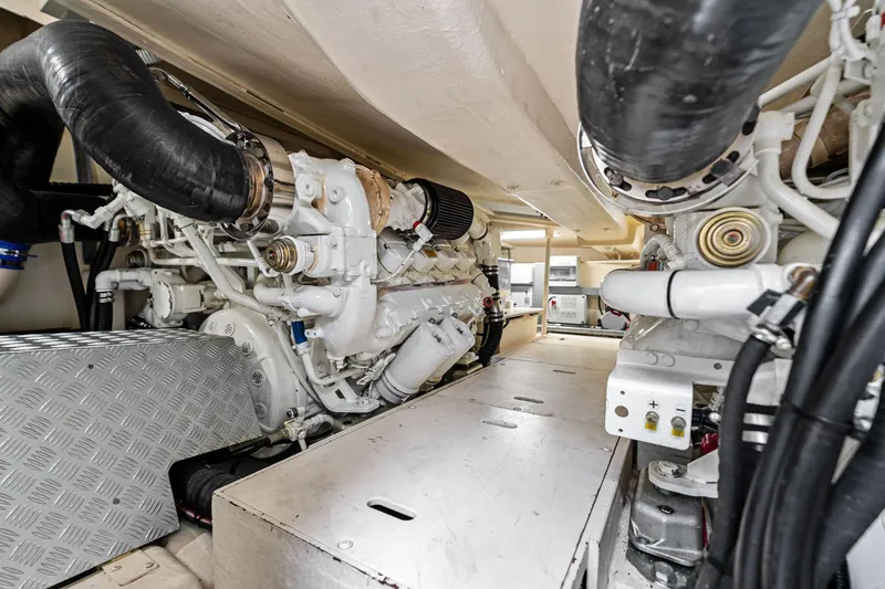 Badleship Yacht Photos Pics Engine room of a 2015 Riva Rivale yacht, showcasing mechanical components and piping.