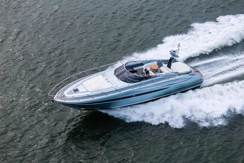 Badleship Yacht Photos Pics 2015 Riva Rivale luxury yacht cruising on open water.