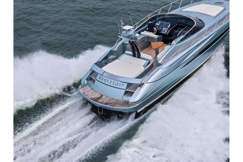 Badleship Yacht Photos Pics Luxury 2015 Riva Rivale yacht cruising on open water, showcasing sleek design and elegance.