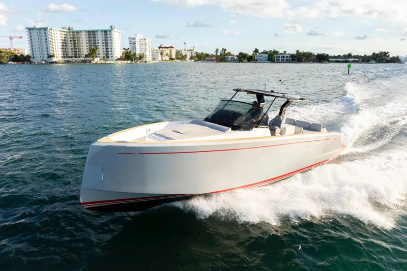  Yacht Photos Pics 2021 Pardo Yachts 38 cruising on water, modern design, coastal background.