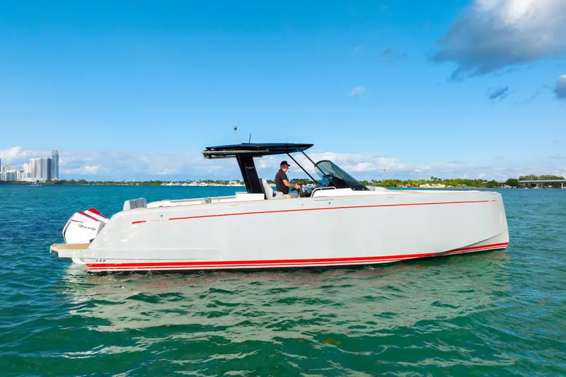  Yacht Photos Pics 2021 Pardo Yachts 38 cruising on clear blue waters under a sunny sky.
