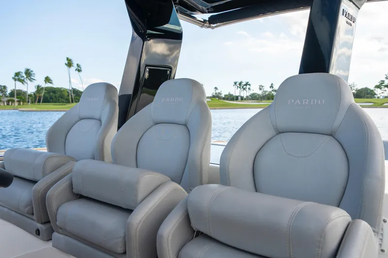  Yacht Photos Pics Luxury seating on 2021 Pardo Yachts 38, with scenic water and palm trees in the background.