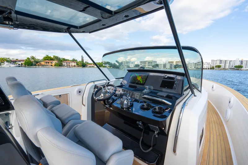  Yacht Photos Pics Cockpit of 2021 Pardo Yachts 38 with modern controls and waterfront view.