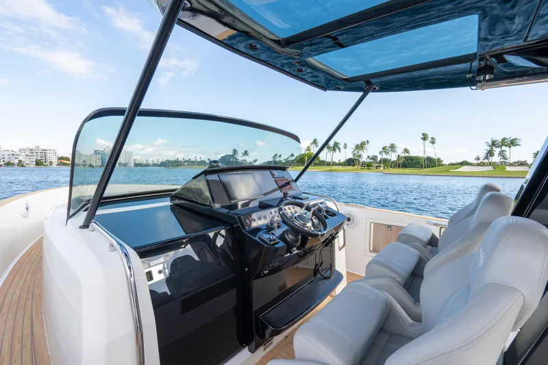  Yacht Photos Pics Cockpit view of 2021 Pardo Yachts 38, featuring luxurious seating and modern controls.