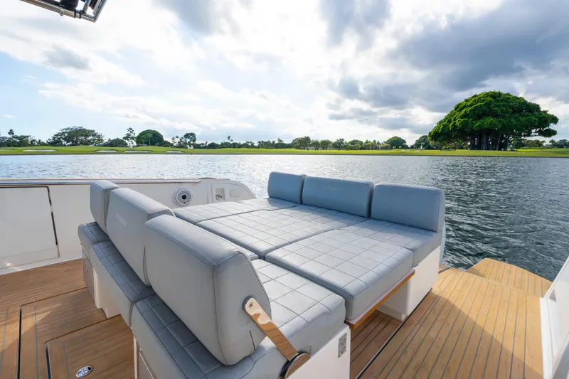  Yacht Photos Pics Luxurious 2021 Pardo Yachts 38 with spacious seating, overlooking serene waters and lush greenery.