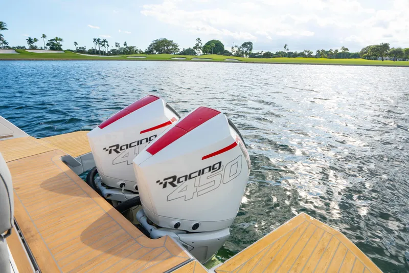  Yacht Photos Pics Twin Racing 450 engines on 2021 Pardo Yachts 38, docked on a sunny lake.