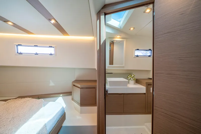  Yacht Photos Pics Luxurious interior of 2021 Pardo Yachts 38, featuring modern bedroom and bathroom design.