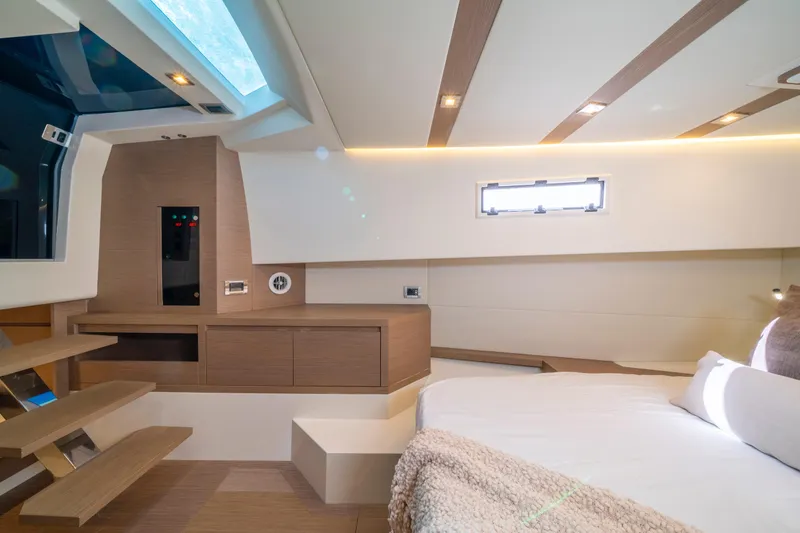  Yacht Photos Pics Luxurious interior of 2021 Pardo Yachts 38, featuring modern design and cozy sleeping area.