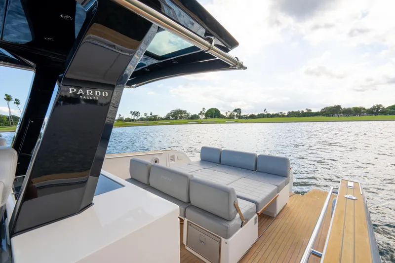  Yacht Photos Pics Luxurious 2021 Pardo Yachts 38 with elegant seating, overlooking serene waters.