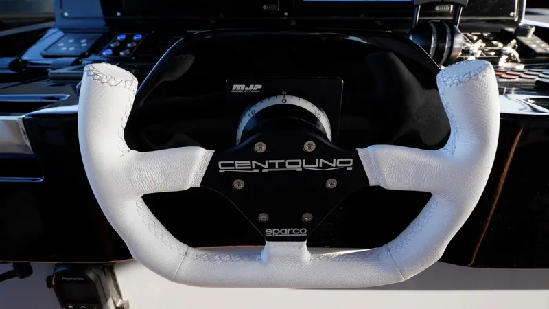 Vespro 55 Yacht Photos Pics Steering wheel of 2026 Centouno Navi VESPRO yacht, featuring white leather and Sparco branding.