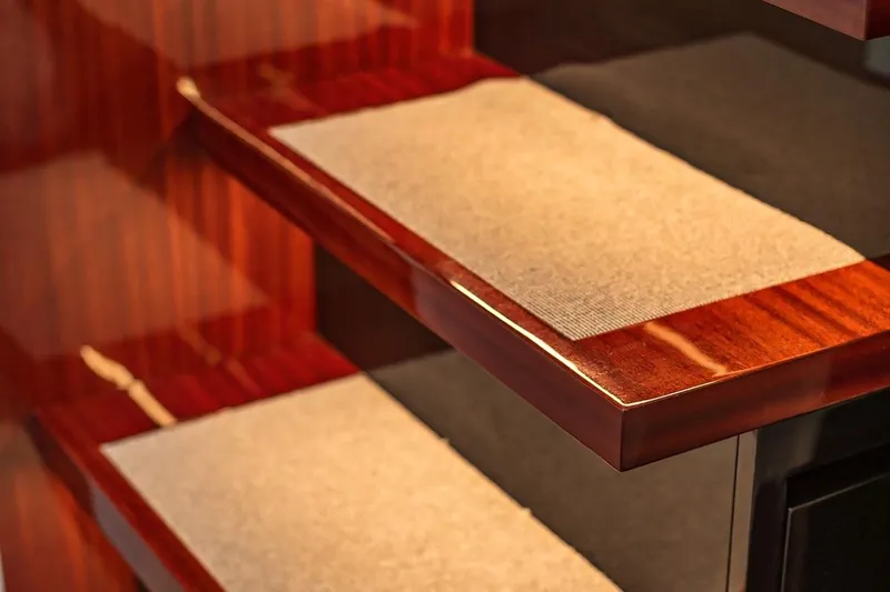 Vespro 55 Yacht Photos Pics Luxurious wooden stairs with carpet, Centouno Navi VESPRO 2026 yacht interior.