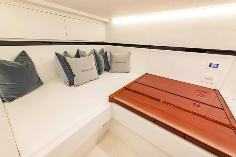 Vespro 55 Yacht Photos Pics Luxurious interior of 2026 Centouno Navi VESPRO yacht with plush seating and elegant wood table.