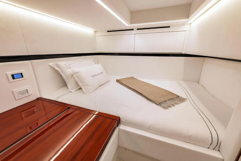 Vespro 55 Yacht Photos Pics Luxurious cabin interior of 2026 Centouno Navi VESPRO yacht, featuring elegant bedding and modern design.