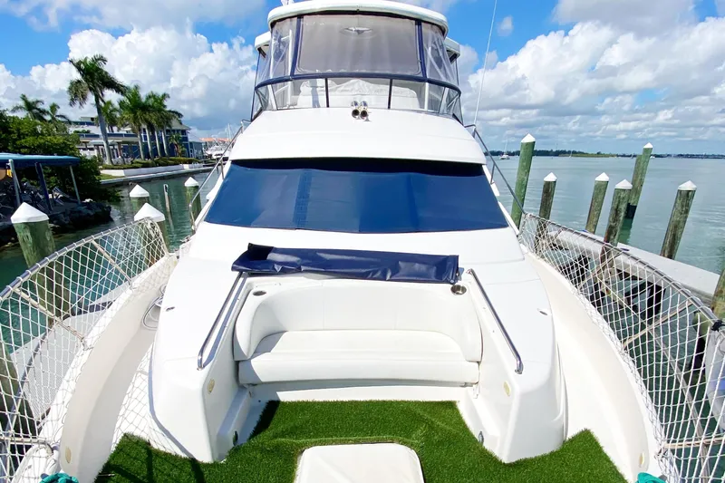 Nauti Boxer Yacht Photos Pics 2003 Silverton 453 Motor Yacht docked, featuring spacious deck and seating area.