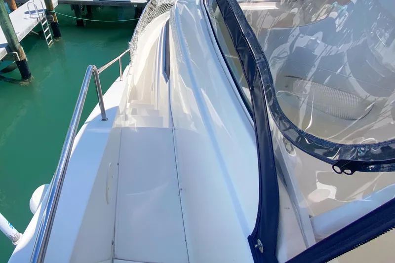 Nauti Boxer Yacht Photos Pics 2003 Silverton 453 Motor Yacht deck with clear enclosure and railing.