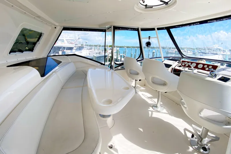 Nauti Boxer Yacht Photos Pics Interior of 2003 Silverton 453 Motor Yacht with helm and seating area.