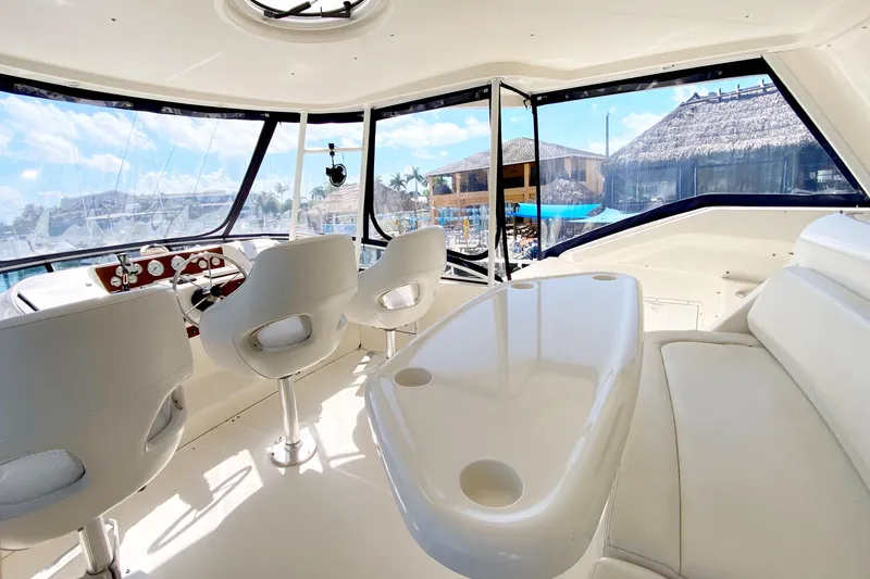 Nauti Boxer Yacht Photos Pics 2003 Silverton 453 Motor Yacht interior with helm, seating, and panoramic windows.