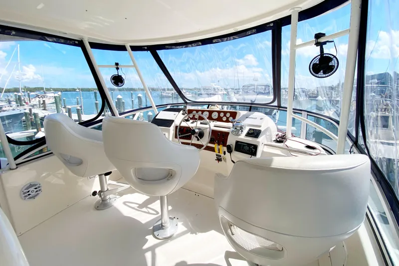 Nauti Boxer Yacht Photos Pics Interior helm of 2003 Silverton 453 Motor Yacht with panoramic marina view.