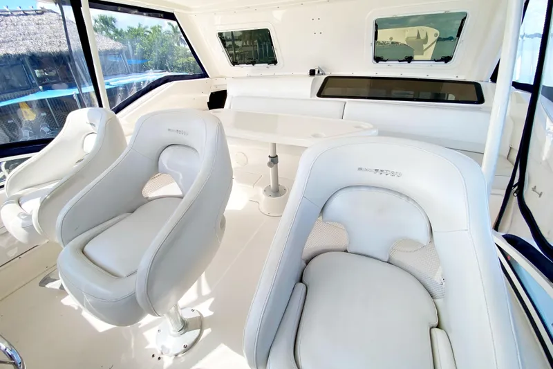Nauti Boxer Yacht Photos Pics 2003 Silverton 453 Motor Yacht interior with white seating and panoramic windows.