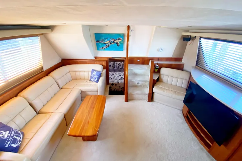 Nauti Boxer Yacht Photos Pics Luxurious interior of 2003 Silverton 453 Motor Yacht with plush seating and elegant decor.