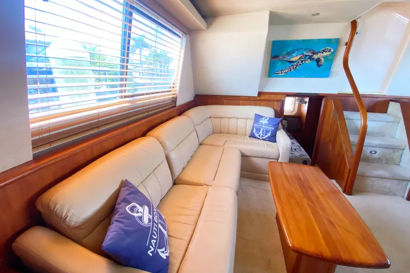 Nauti Boxer Yacht Photos Pics Luxurious interior of 2003 Silverton 453 Motor Yacht with beige seating and wooden accents.